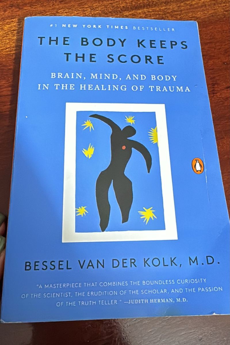 The Body Keeps the Score by Bessel van der Kolk, the book Kadine is reading now