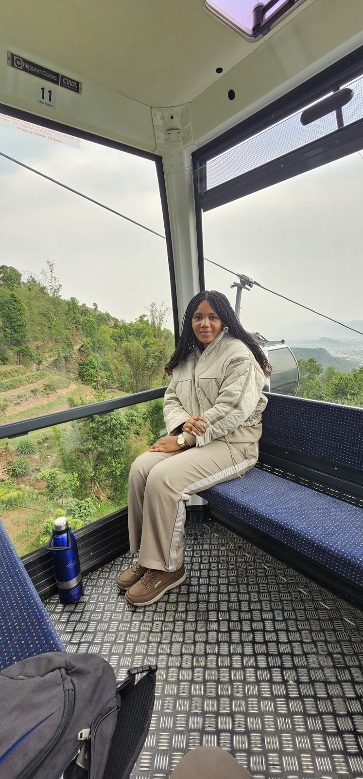 Kadine Reynolds in a cable car over the Annapurna range, Nepal