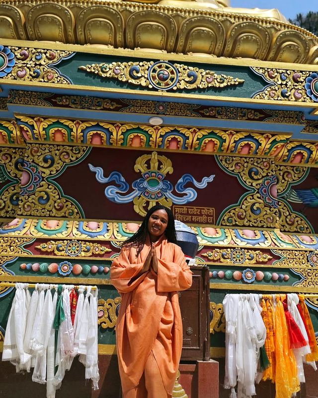 Kadine Reynolds: Before a golden Buddha, Kathmandu, Nepal