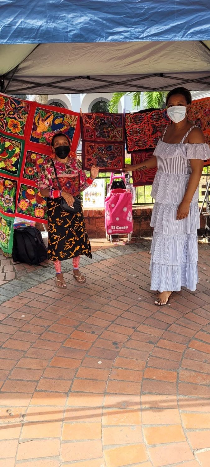 Kadine Reynolds with a Guna mola seller, Panama City, Panama