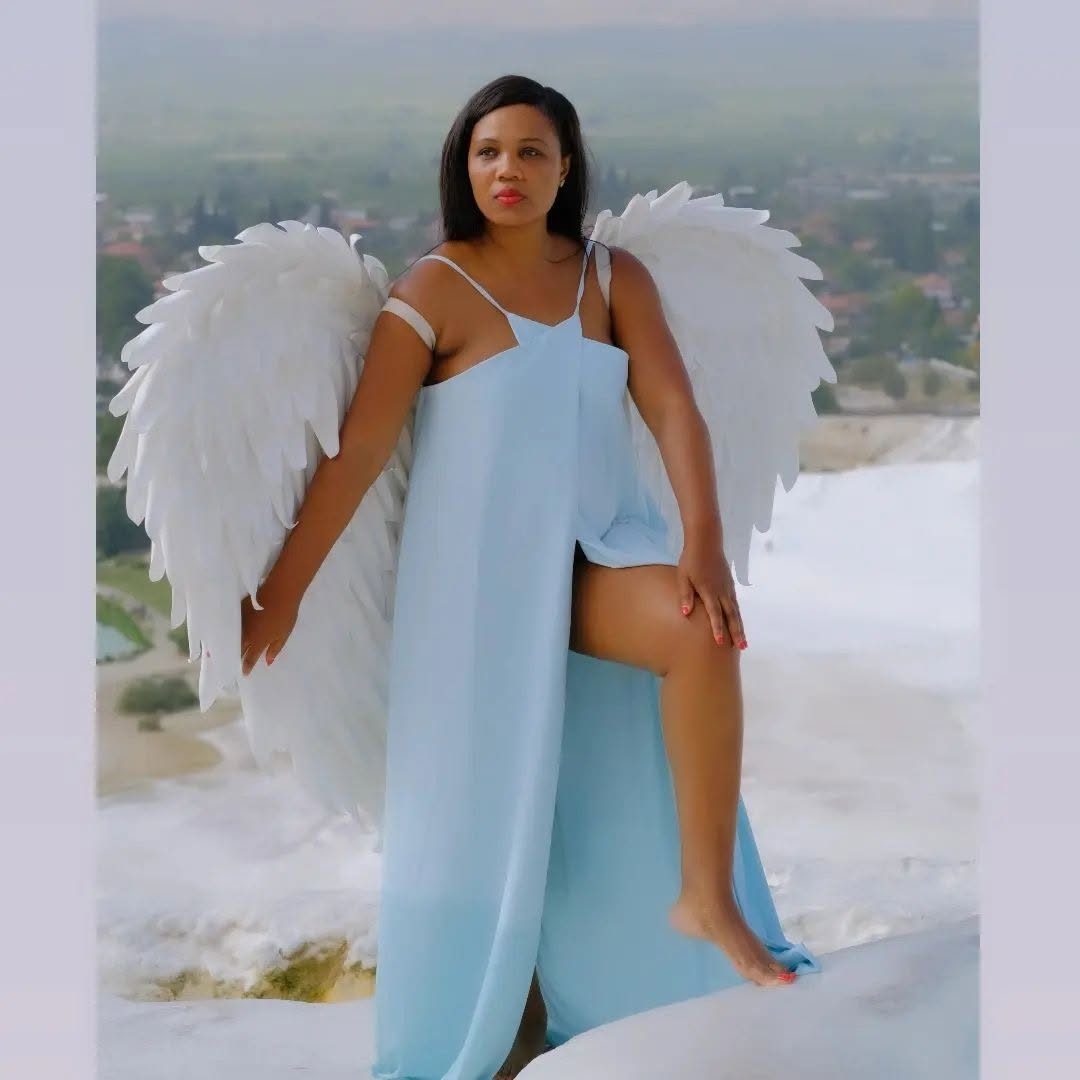Kadine Reynolds in angel wings at Pamukkale, Turkey, close view
